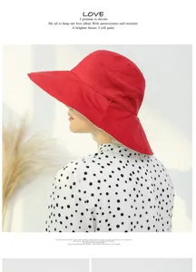 Detailed view of the red summer sun hat, large brim fisherman cap, stylish casual headwear.