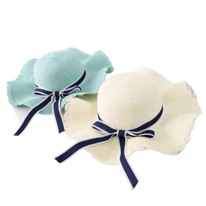 Women summer sun straw hat with elegant navy bow, wide brim beach hat for outdoor travel.