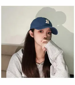 Unisex washed cotton baseball cap with classic letter embroidery, perfect for spring and summer.