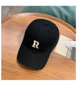 Black washed cotton baseball cap with embroidered letter R, retro style soft top hat.