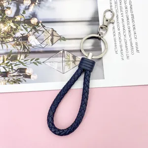 Blue braided leather keychain with metal clasp and keyring, perfect for car keys and bags.