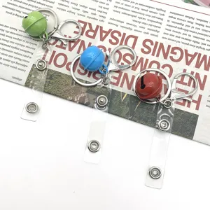 Colorful bell keychains with clear plastic snap straps and metal clasps, perfect for DIY bag accessories.