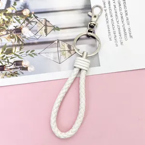 White braided leather keychain with metal ring and clasp, stylish lanyard for car keys.