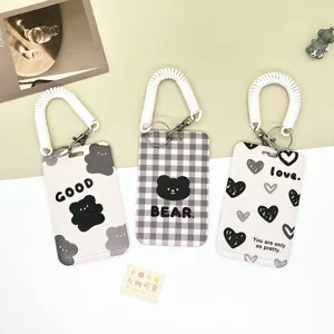Cute transparent slide badge holder with spring coil wrist strap for student bus metro cards.