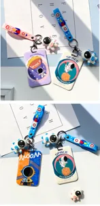 Detailed view of astronaut hard card holder with lanyard and cute space cartoon charm.