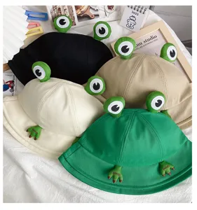 Cute frog bucket hat detail shot, summer sun protection cotton cap with playful 3D frog eyes.