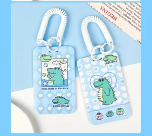 Cute cartoon crocodile student card holder with white coiled lanyard, ABS plastic sleeve.