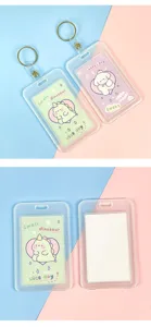 Transparent PVC ID card holder with cute cartoon insert card and metal keyring for student badges.