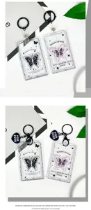 Transparent card holder detail view featuring cute butterfly motif and keychain design.