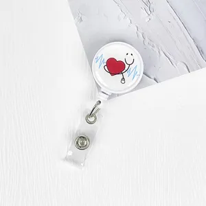 Retractable nurse badge reel with cute stethoscope heart design, white plastic ID card holder clip.