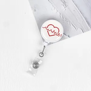 Retractable ID badge reel holder with cute red heart ECG pattern for medical staff.