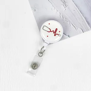 Retractable nurse badge reel with cute stethoscope design, perfect for holding ID cards and keys securely.