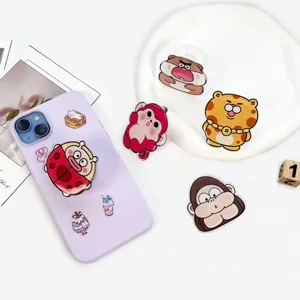 Süßer Cartoon Acryl Handy Halter mit verstellbarem Luftkissen Design für den Schreibtisch.