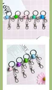 Detailed view of candy color cute bell keychains with double clasps for bags.