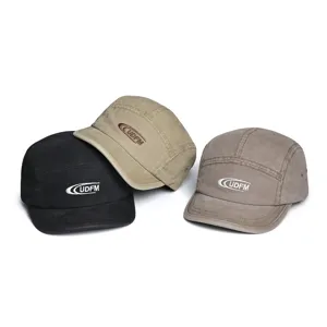 Vintage washed cotton 5-panel cap detail, short brim baseball hat with UDFM embroidery.