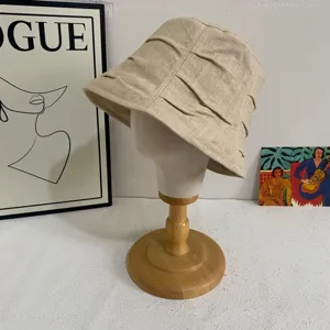 Detailed view of Japanese pleated bucket hat, breathable lightweight summer sun cap.
