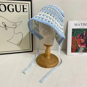 Handmade crochet hollow strap bucket hat detail view, breathable sun protection sun hat for women.