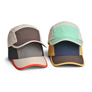 Close-up detail view of multi-color quick-dry 5-panel caps showing breathable fabric.