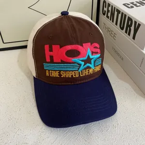 Detailed close-up of the retro color block baseball hat with front embroidered text.