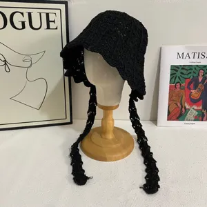Black crochet bucket hat with long string ties, hollow out summer sun hat detail.