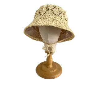 Beige hollow crochet bucket hat, straw woven sun protection hat for women, ideal for beach and travel.