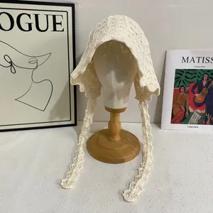 Beige handmade crochet hollow ribbon bucket hat for women, vintage spring summer sun protection.