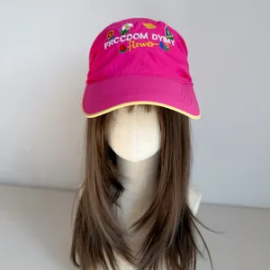 Sweet pink embroidered baseball cap with wide brim, cute floral design and fashion style.