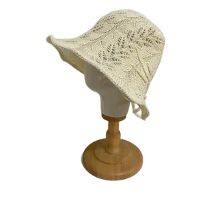 Korean style hollow knit bucket hat for women, breathable summer sun hat with ribbon ties.