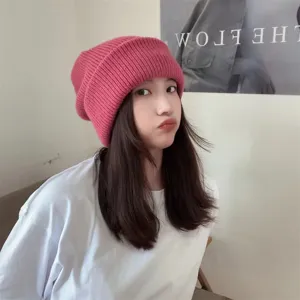 Pink knitted beanie hat for women, cozy winter warm slouchy cap, casual daily outdoor wear.