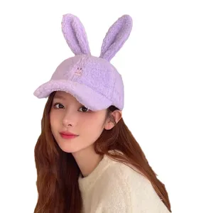 Plush rabbit ear baseball hat for women, cute winter lamb fleece duckbill cap in purple.