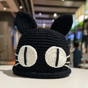 Cute black crochet cat ear beanie winter warm handmade knitted hat for women sweet daily wear.