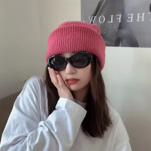 Pink ribbed knit beanie for women, stylish winter warm pullover wool hat and casual daily cap.
