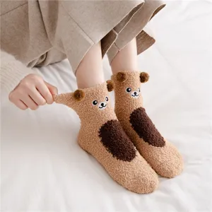 Fluffy coral fleece sleep socks for women, thick warm winter fuzzy home socks with cute bear design.