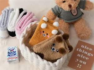 Cozy coral fleece home socks detail, cute bear face embroidery and plush ears design.
