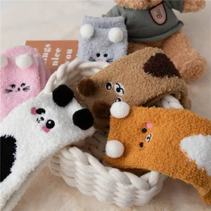 Thickened coral fleece cozy winter sleep socks with cute animal plush details in basket