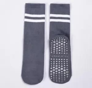 Grey yoga grip socks for women, non-slip pilates and fitness floor socks with stripes.