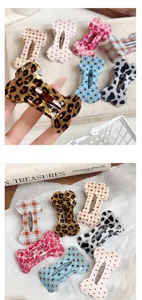 Cute bone-shaped hair clip with leopard print and polka dot designs for daily styling.