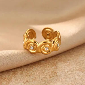 Gold plated stainless steel spiral flower ring, minimalist geometric fashion detail.