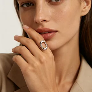 Chunky silver geometric oval ring, minimalist modern stainless steel jewelry for women detail.