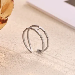 Stainless steel double band ring with crossbar detail, minimalist fashion jewelry for women.