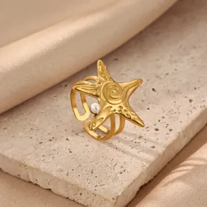 Gold starfish adjustable ring with pearl detail, chic stainless steel fashion jewelry for women.