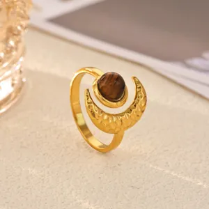 Detail view of the 18k gold plated stainless steel crescent moon ring with stone accent.