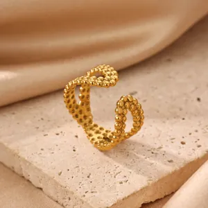 Close-up detail of the elegant 18K gold plated stainless steel open ring with unique textured beaded design
