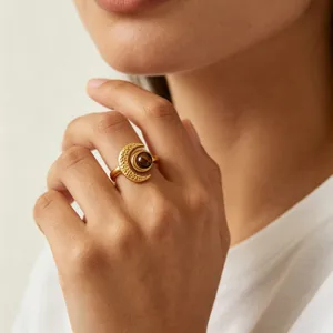 Stunning gold crescent moon ring with brown stone detail, elegant jewelry piece for women.