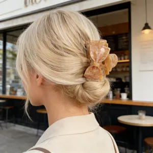 Elegant acetate hair claw clip for women, stylish bow design hair accessory for daily styling.