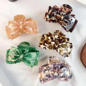 Elegant acetate bow hair claw clips, stylish shark clips for women daily coiling updo styling.