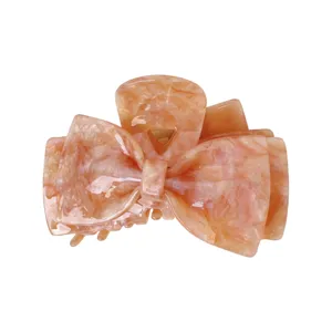 Acetate bow hair claw clip for women, elegant peach marble hair styling shark clip accessories.