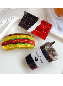 Gros plan détaillé de pinces à cheveux en acrylique créatives en forme de nourriture.
