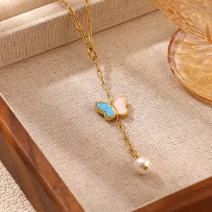 Gold-plated stainless steel necklace with blue-pink enamel butterfly and pearl pendant detail.
