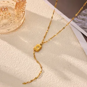 Gold Y-shaped long necklace featuring a square sunburst crystal pendant for women fashion detail view.